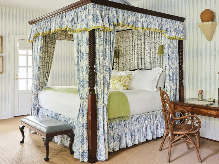 Room with canopied bed and striped wallpaper at The Mayflower Inn