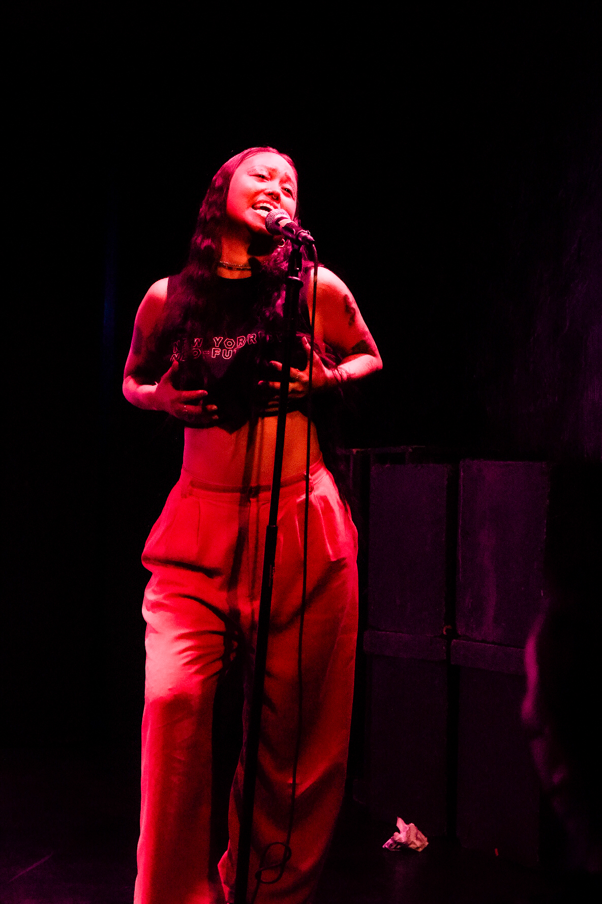 A person sings on stage