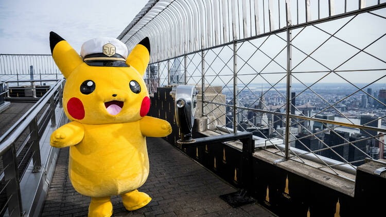 pikachu stands at the top of the empire state building