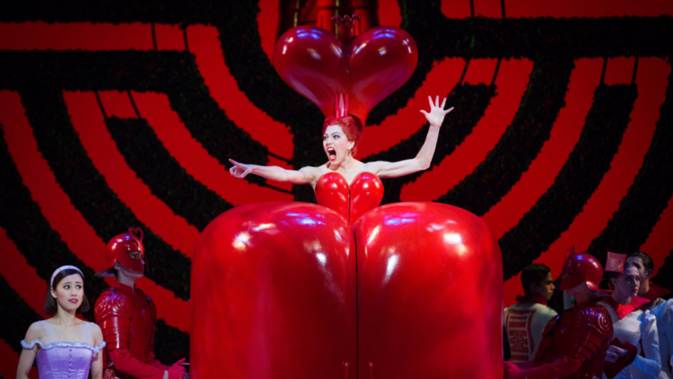 A dancer in a huge queen of hearts costume.