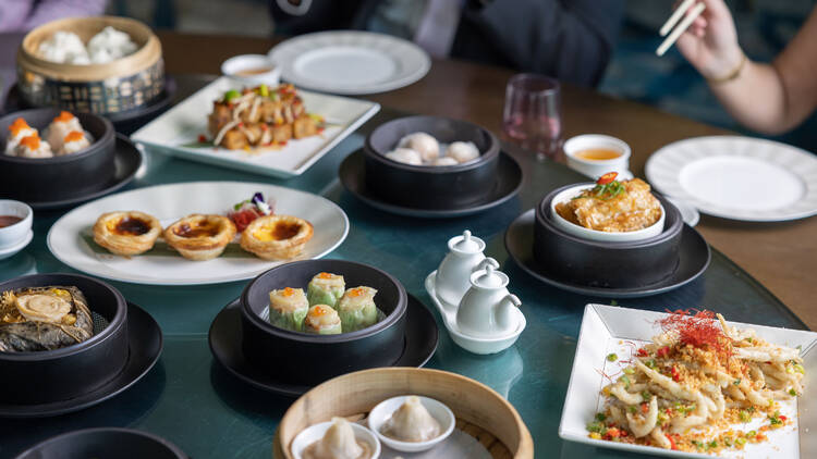 Assorted yum cha dishes and pots of tea at Silks.