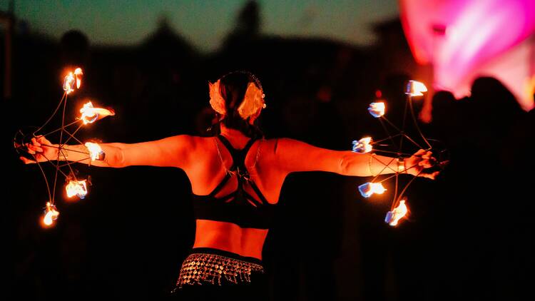 A performer doing fire twirling