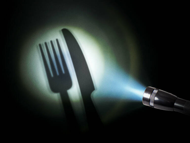 A torch shining a light on cutlery