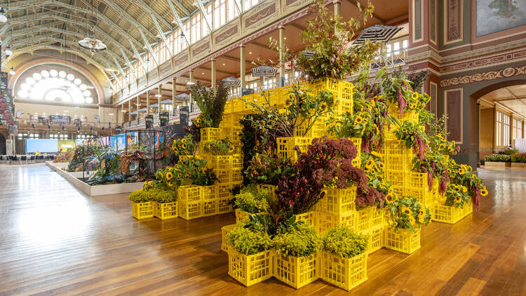 A large floral display using painted milk crates.