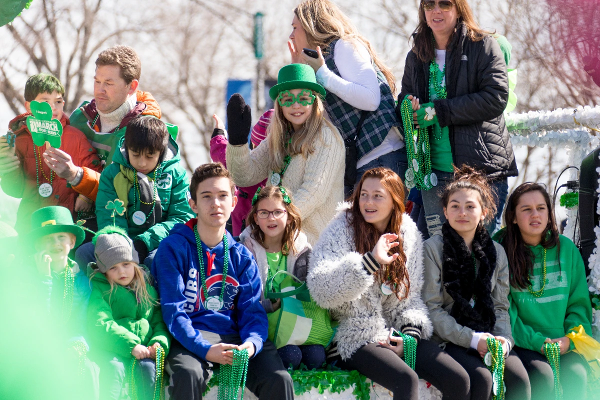 A crowd of people watching a parade