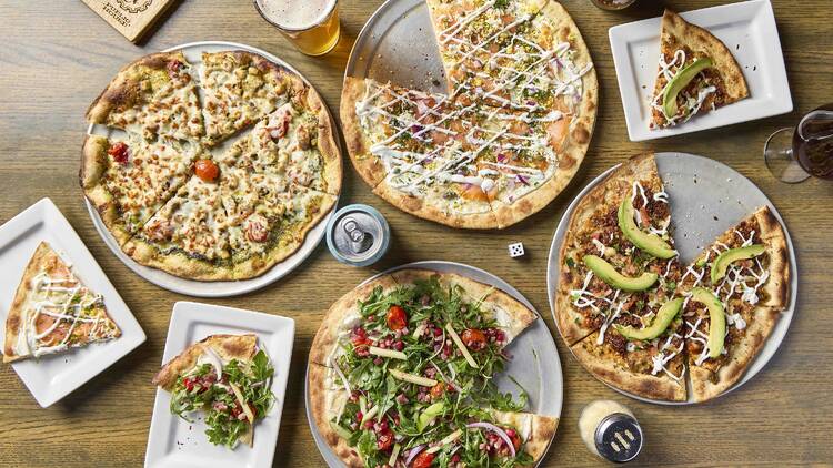 Four pizzas on a table