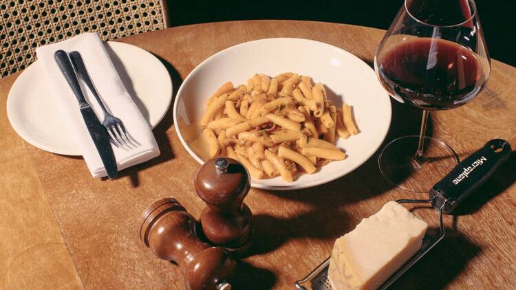 Bowl of pasta with red wine