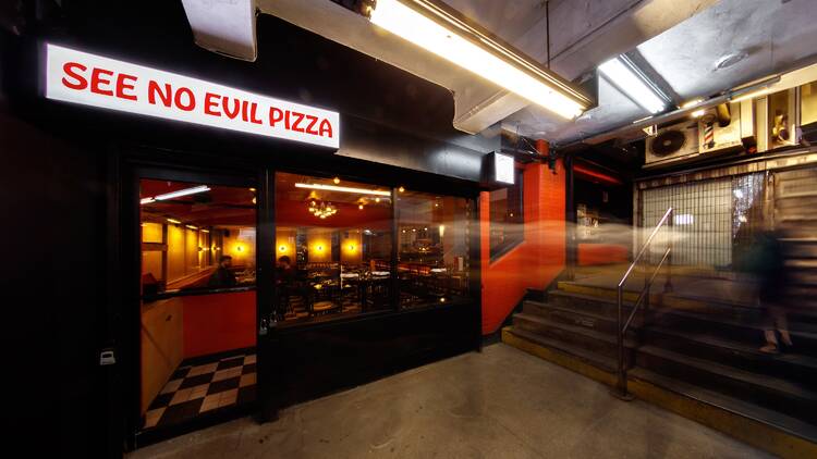 Eat at a hidden pizzeria in a train station