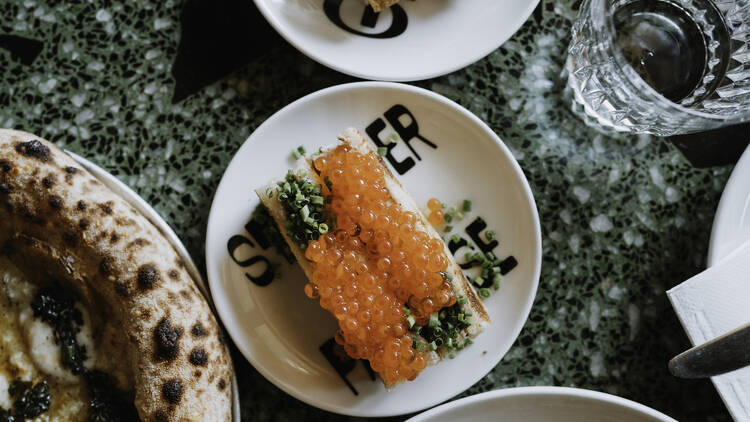 A snack on a plate with fish eggs