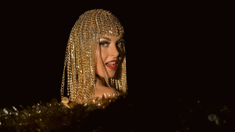 A woman wearing a shiny head piece at The Emerald Room