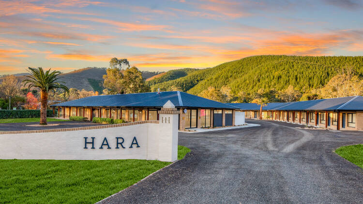 Driveway of Hara House with Victoria's mountainous High Country landscape in the background.