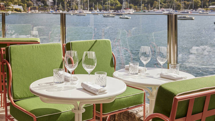 Green chairs at Sails on Lavender Bay