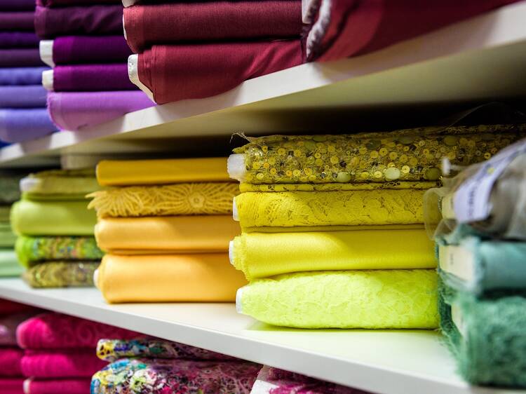 Rolls of colorful textiles in a fabric store