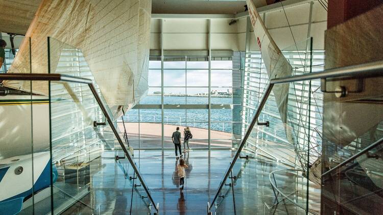 Stairs leading down to a big foyer overlooking the water