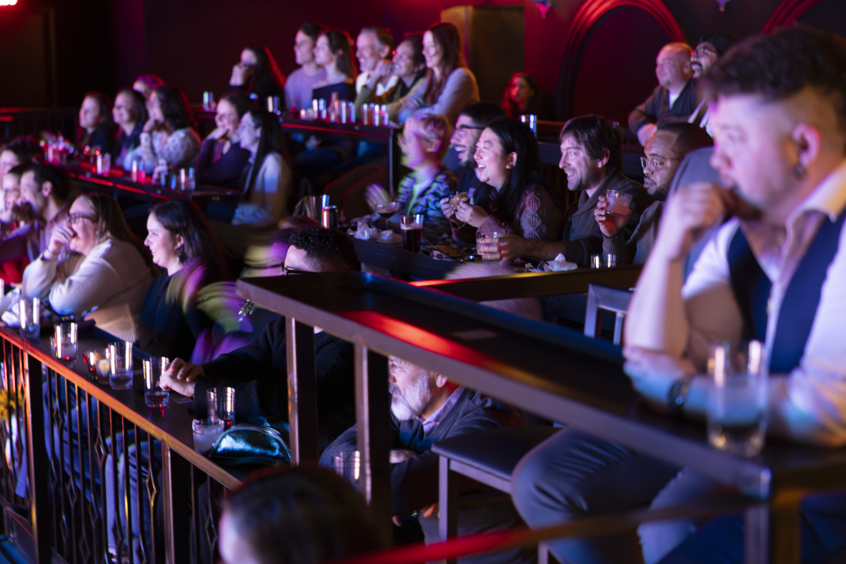 The audience at Second City laughs during a show.