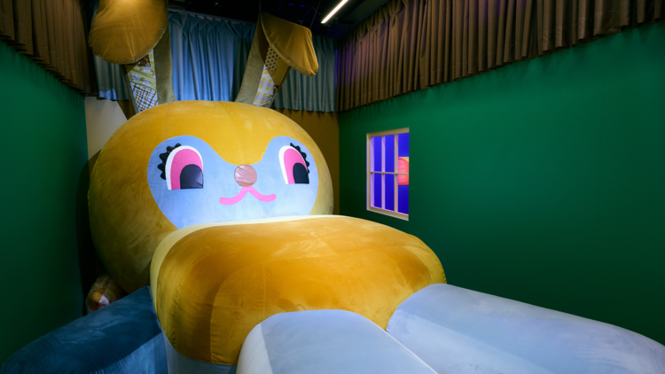 A giant toy bunny that takes up an entire room