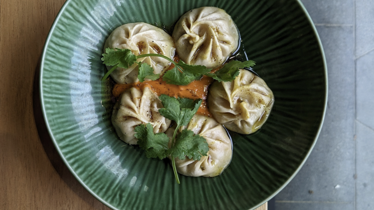 Such and Such's dumplings in a green bowl