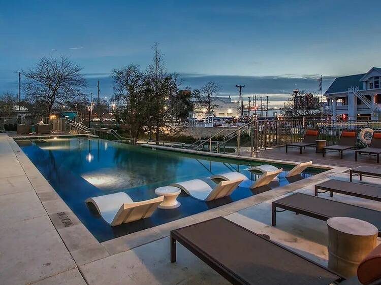 A downtown apartment with fire pits and a rooftop