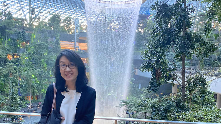BA employee Misako Yaji in front of fountains at Singapore Changi Airport