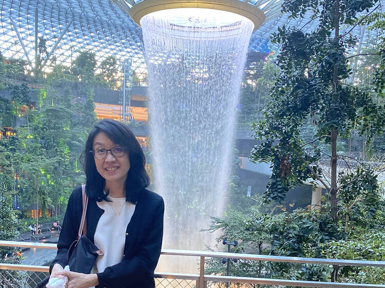 BA employee Misako Yaji in front of fountains at Singapore Changi Airport