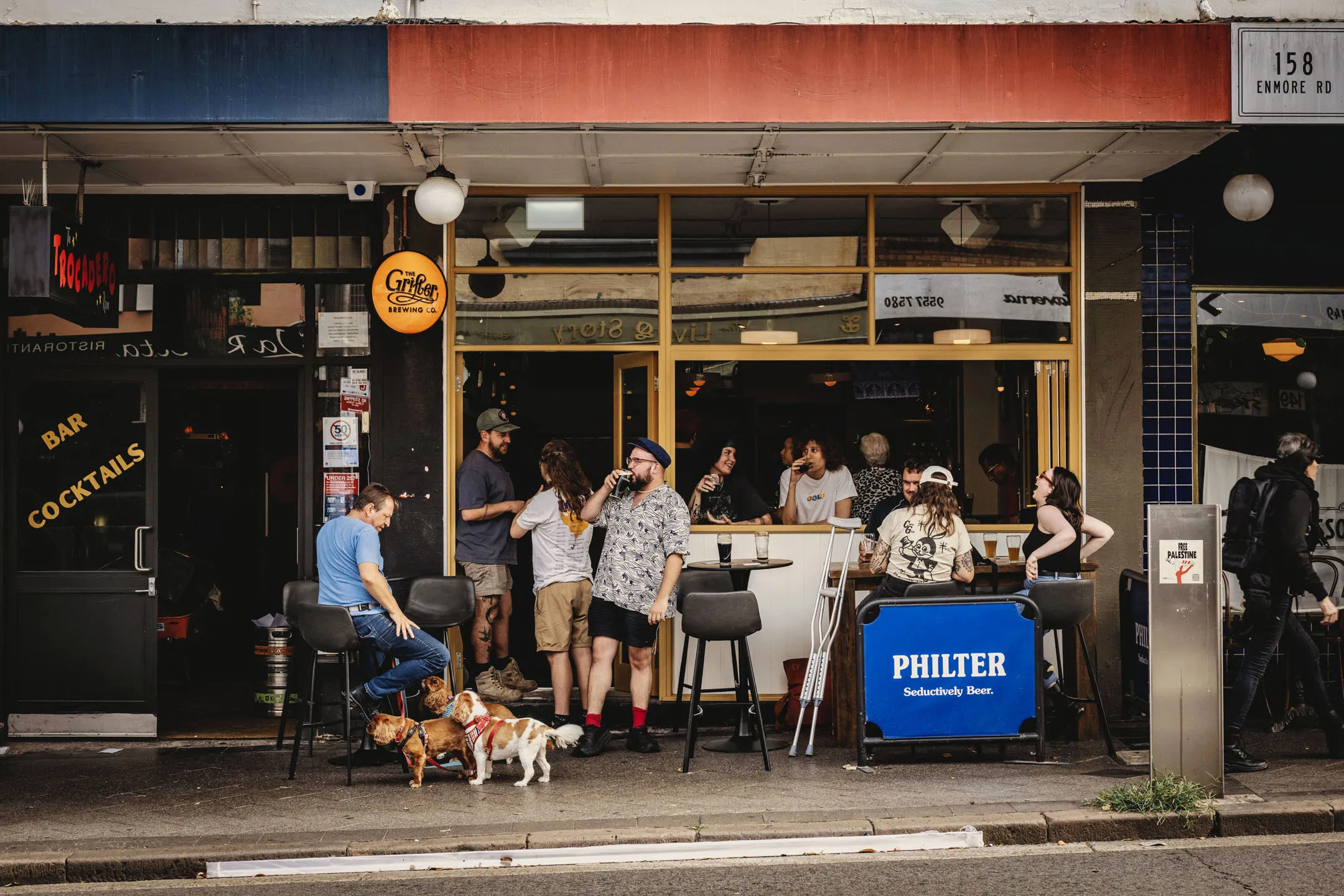 People drinking and laughing at The Magpie