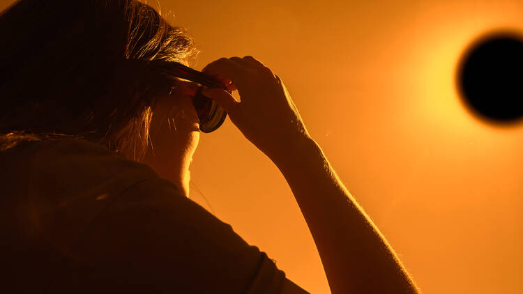 Woman looking at solar eclipse