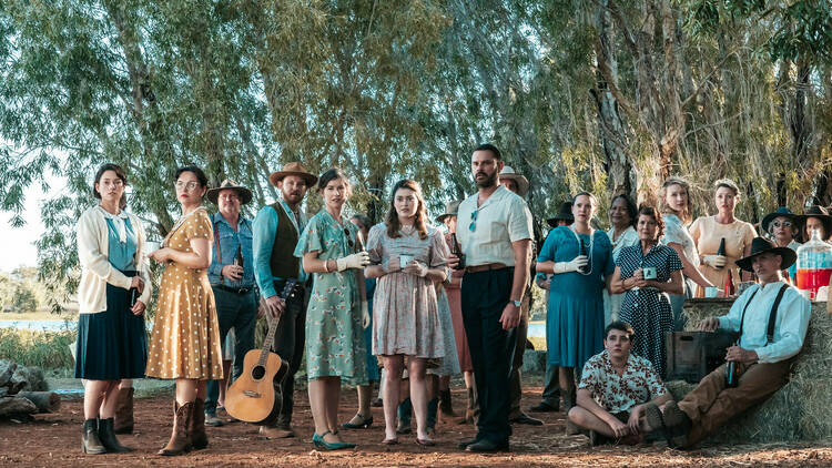 A film still of a group of people outdoors