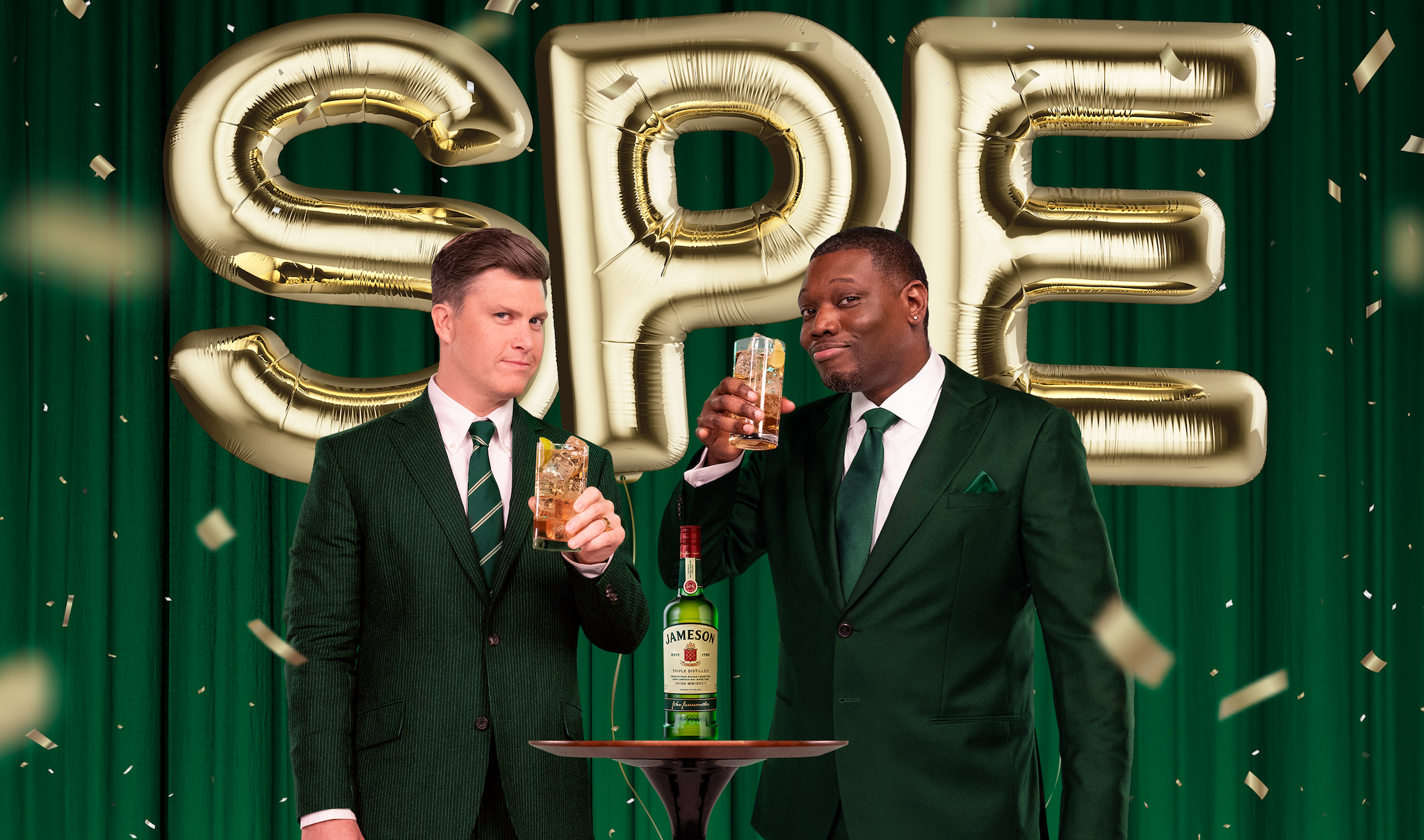 Comedians Colin Jost and Michael Che hold Jameson drinks.