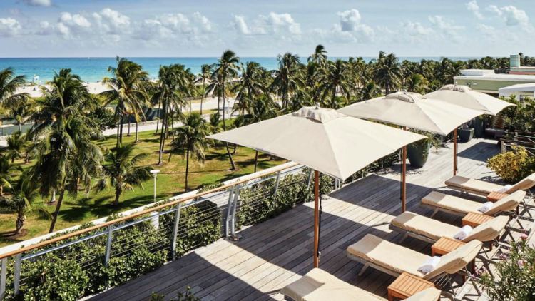 Rooftop terrace with loungers at Betsy Hotel in Miami