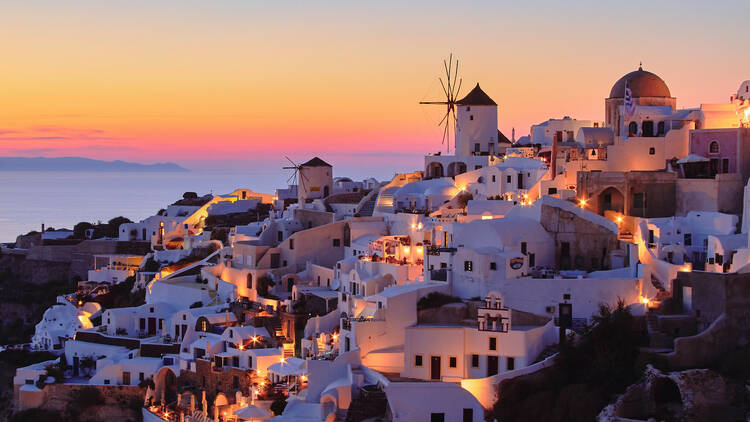 A view of a Greek island at sunset. 