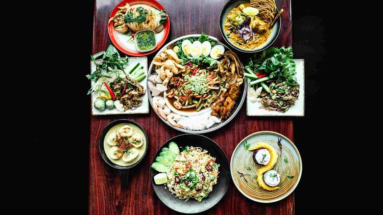Spicy Sugar's somtum tad (center). From clockwise: Khao soi, pork namtok, mango sticky rice, chef Katt's special fried rice, green curry dumplings, duck larb and whole grilled squid. 