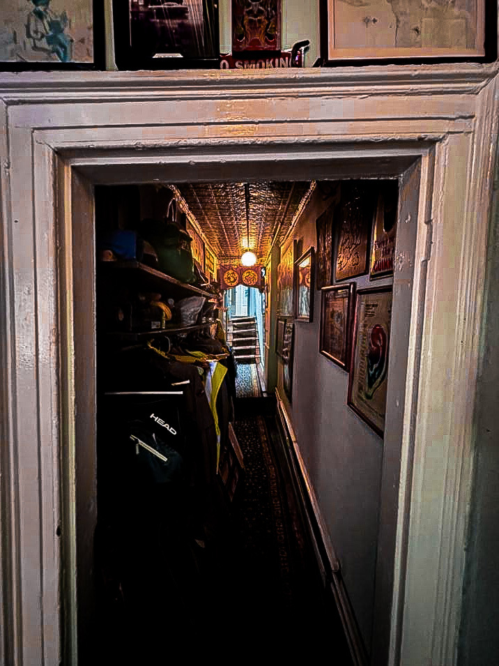 One of the several hallways and slanted steps in the upstairs apartment above Ear Inn