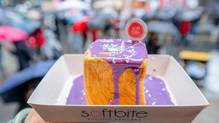 A souffle pancake with purple icing.