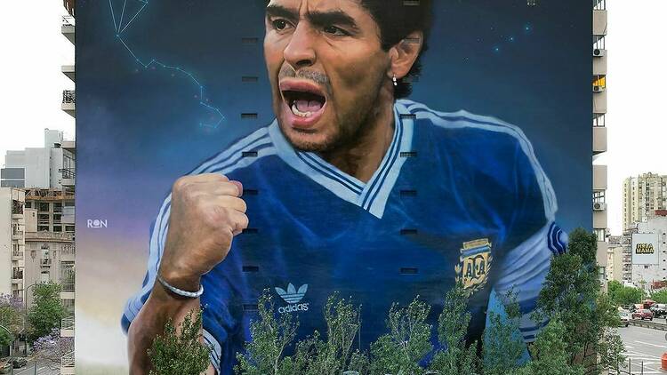 Perform an impossible dribble in a Diego Maradona mural