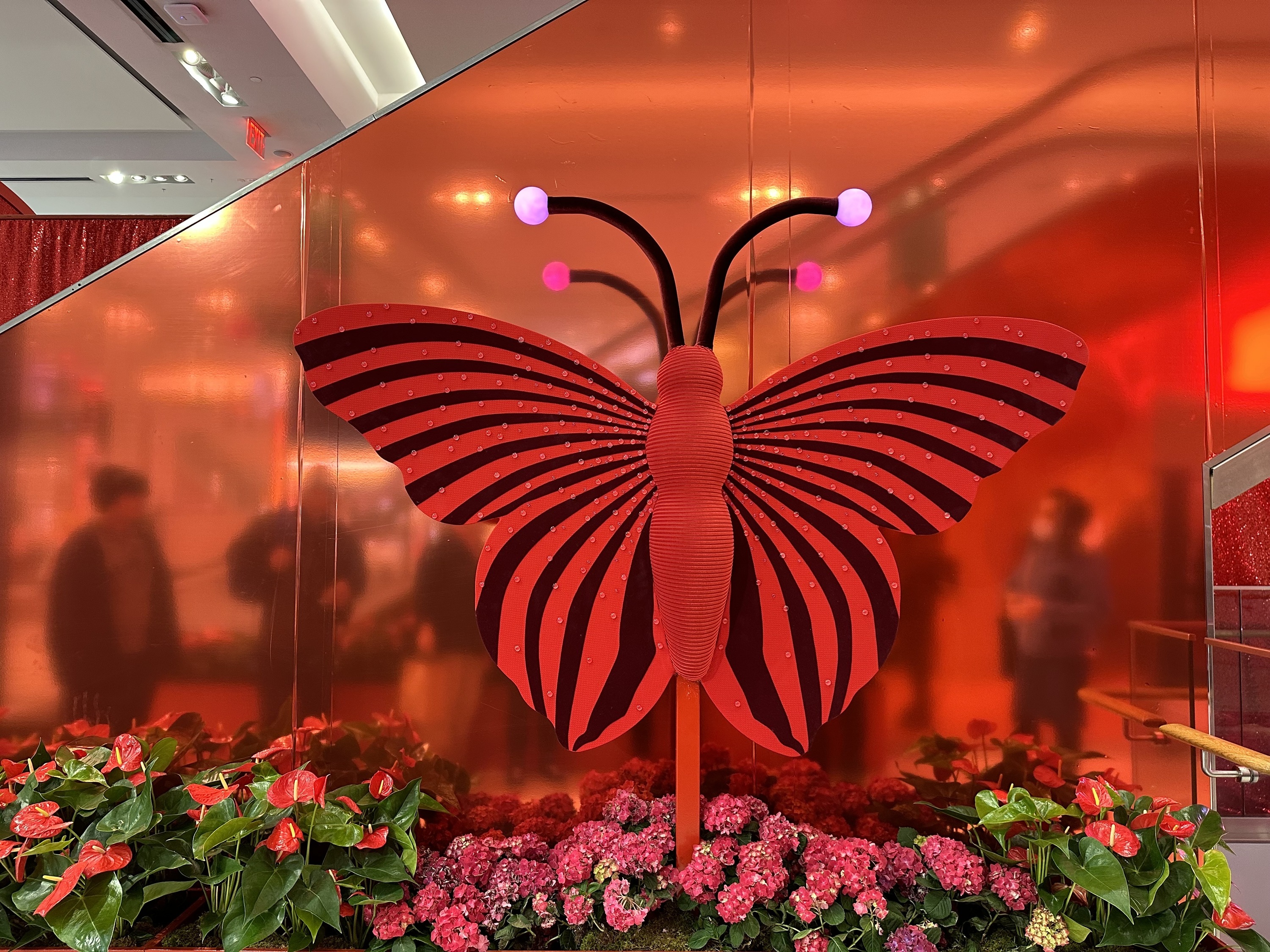 A red-and-black butterfly with light-up antennae.