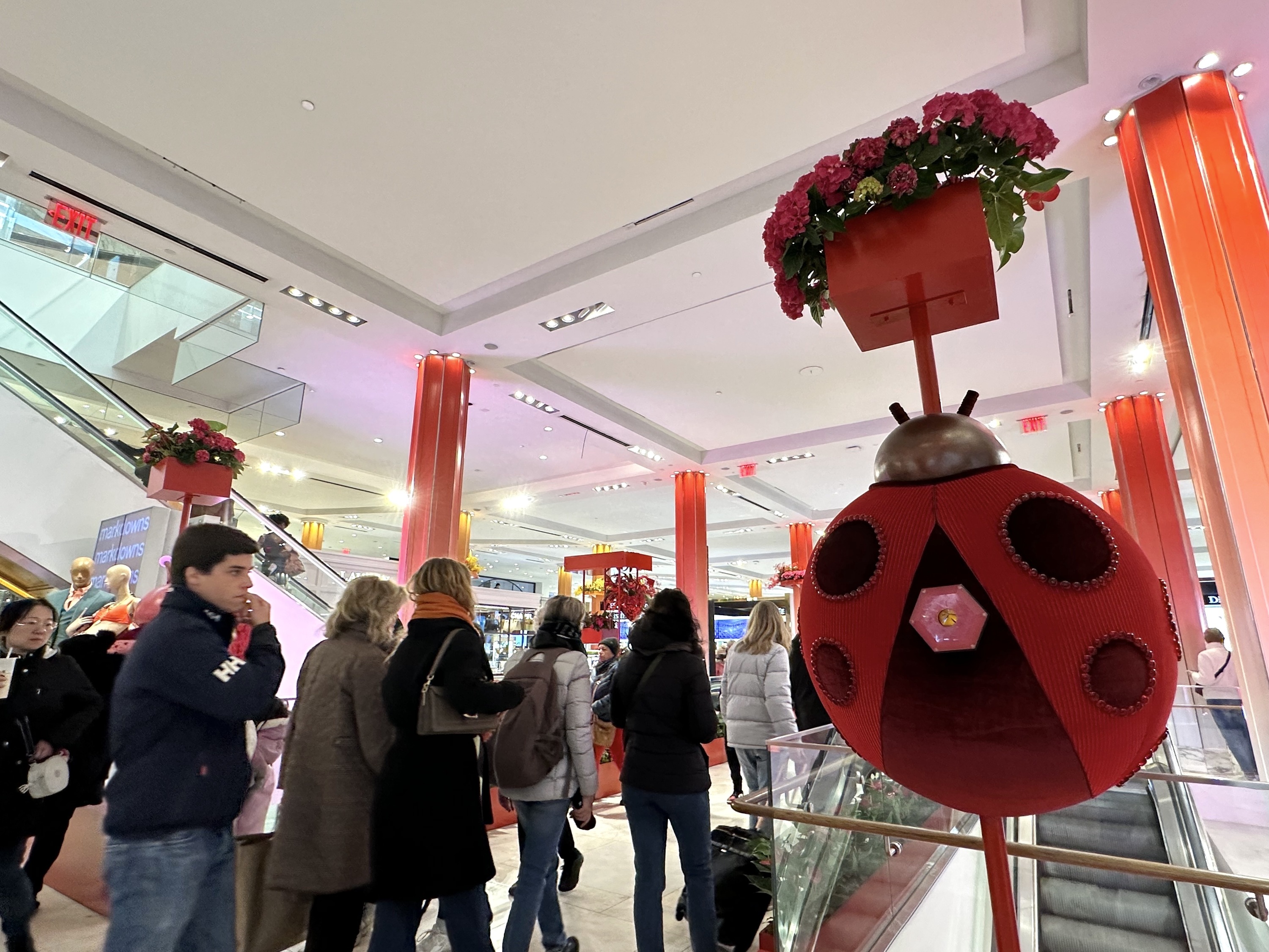 A ladybug display with a kaleidoscope on its back.