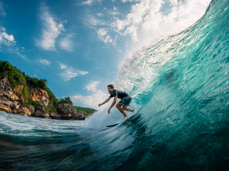 Try your luck at Bali’s most epic surf break at Padang Padang beach in Bali