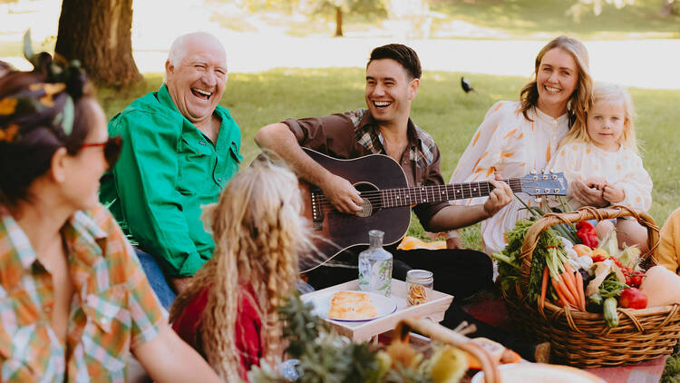 A group of people having a picnic in the park.