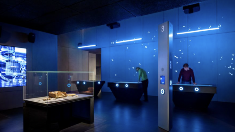 Neon blue exhibition room at the SPYSCAPE Spy Museum
