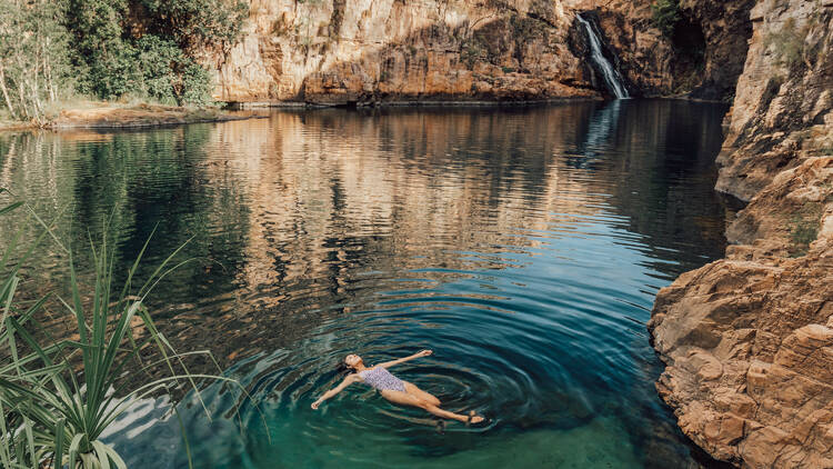 Woman relaxing at Barramundi Gorge (Maguk)