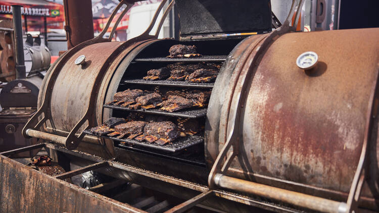 A barbecue cooking ribs at Meatstock Festival