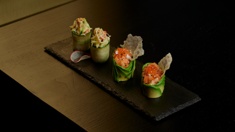 A plate of elegantly prepared sushi. 