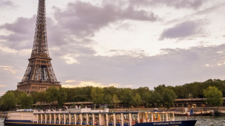 River cruise along the Seine with the Eiffel Tower in the background. 