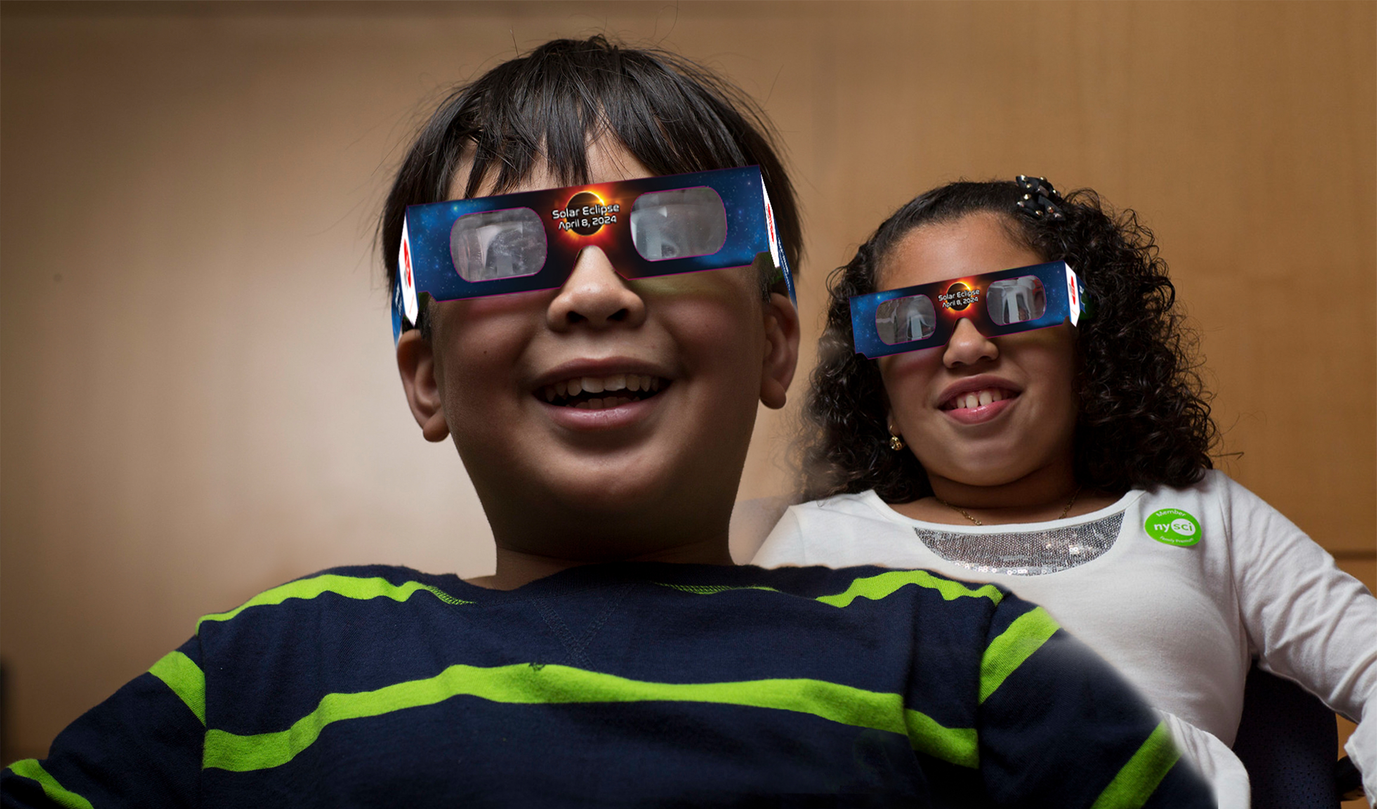 Kids in eclipse glasses.