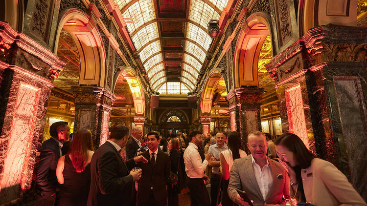 A grand-looking bar filled with people