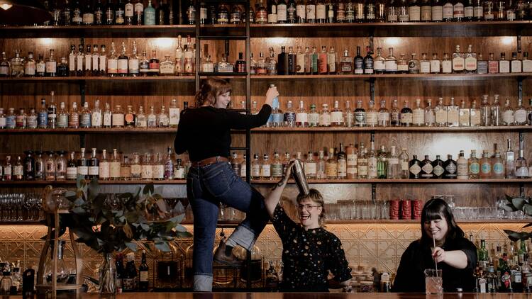 People dancing on a bar counter