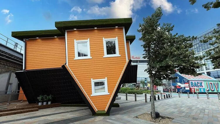 upside down house white city 