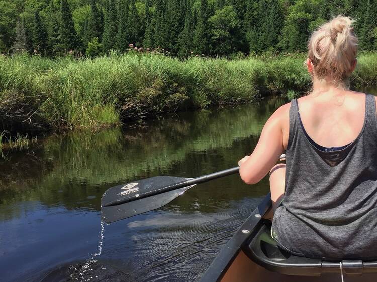 Canoe through connected lakes in the Adirondacks