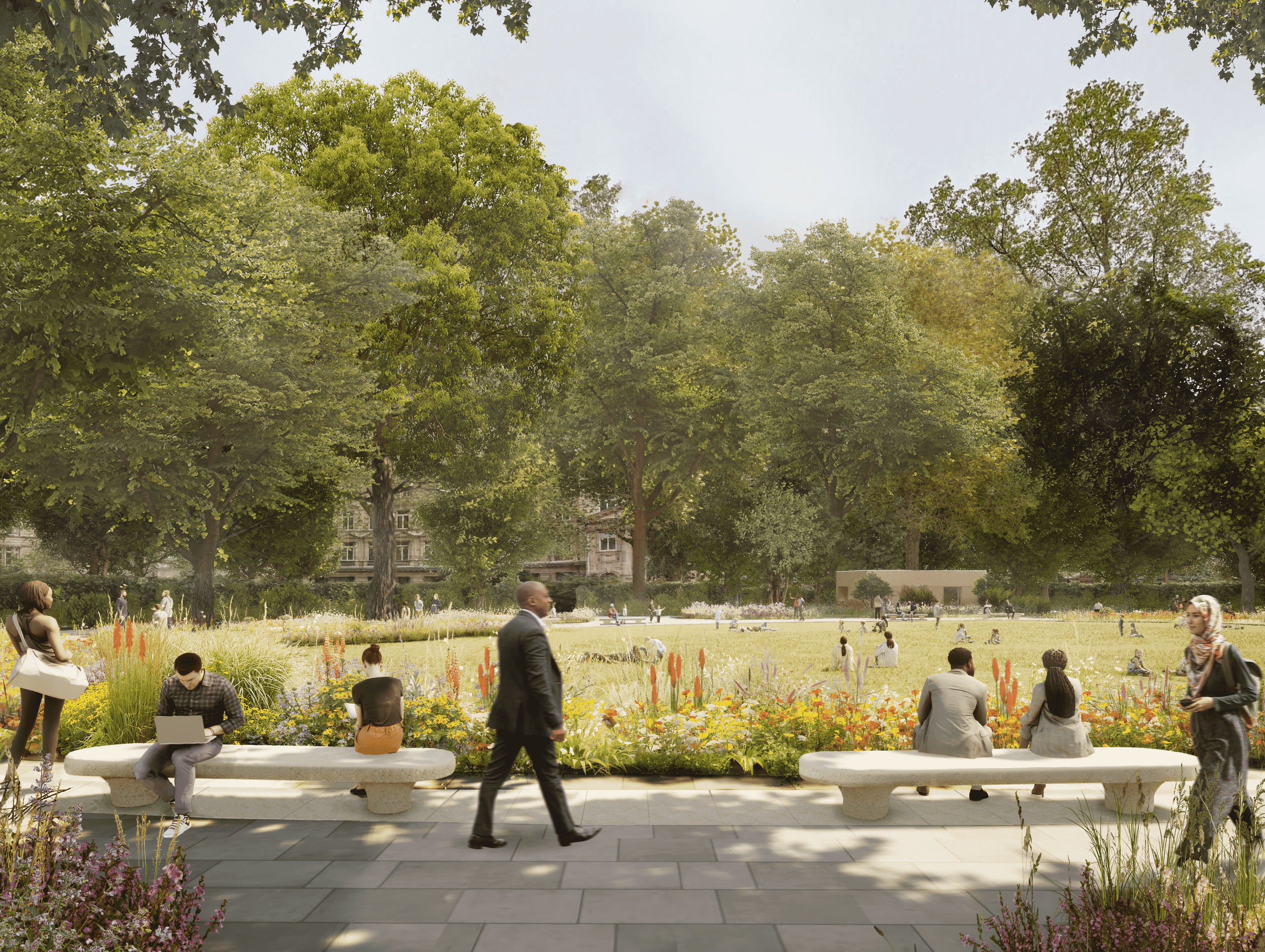 A park with big trees, benches and a pathway 