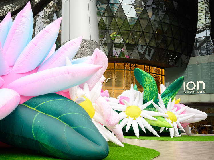 Gigantic floral inflatables outside of ION Orchard